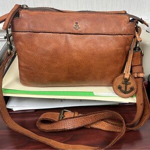Brown Leather Crossbody Bag with Adjustable Strap and Metal Accents